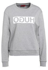 Sudadera gris en mezcla de algodón, con un diseño recortado, escote redondo y un destacado logo blanco en el pecho. Puños y dobladillo de canalé.