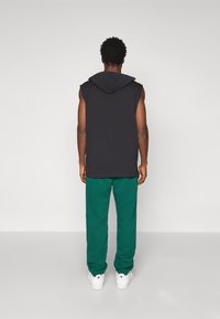 Champion ICONS CUFF PANTS - Jogginghose - dark green