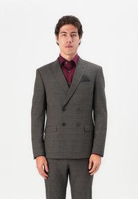Double-breasted gray plaid suit with black buttons, paired with a maroon shirt; features a pocket square in the blazer.