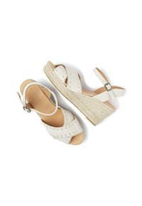 White wedge sandals with cross-strap design, made of leather, featuring stitched accents and a jute-wrapped sole. Adjustable ankle strap included.