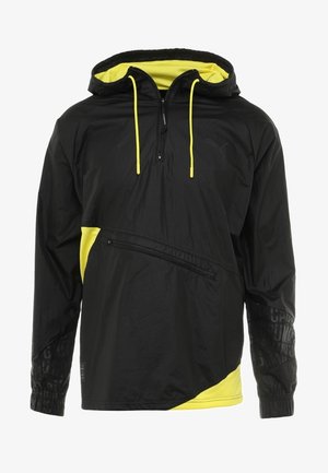 Giacca leggera nera con fodera del cappuccio in mesh giallo, coulisse gialle, tasca laterale con zip e accenti gialli testurizzati all'orlo.