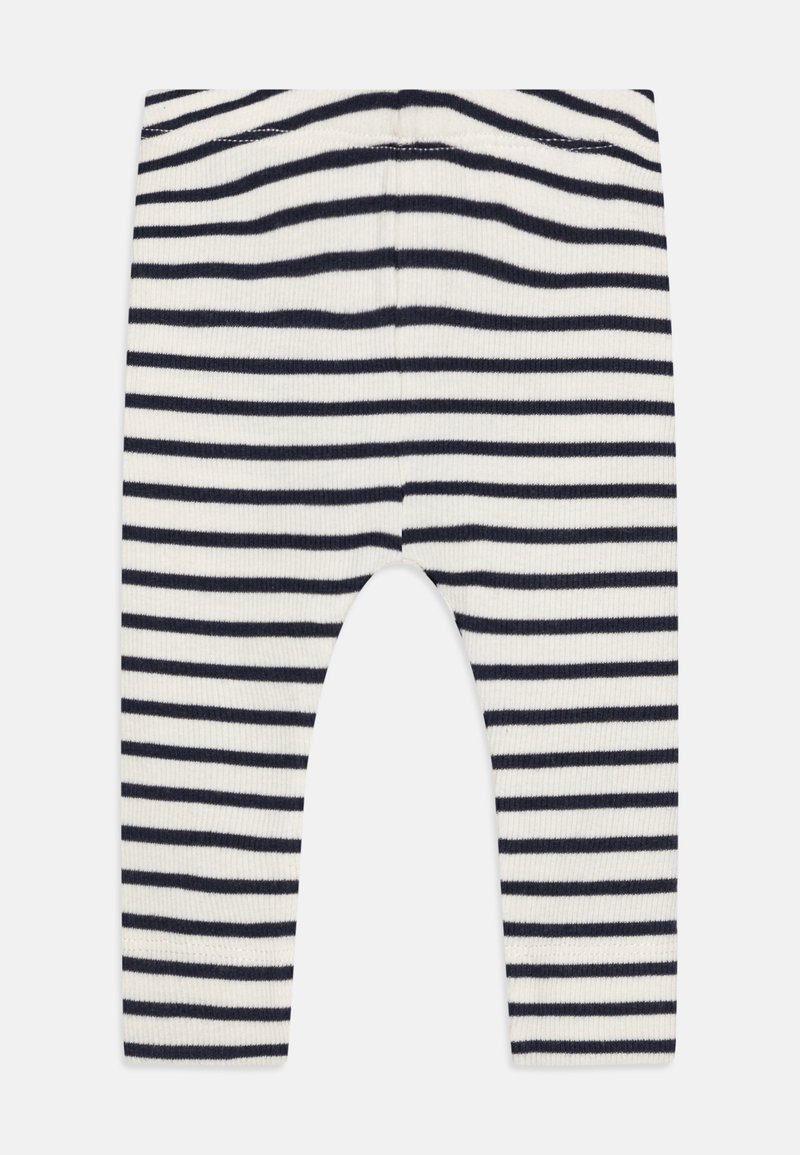 Leggings côtelés avec des rayures horizontales bleu marine et blanches, en tissu extensible et avec une coupe arrondie à la cheville pour le confort.