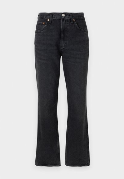 Black flared jeans made of denim, featuring a high waist, front pockets, and copper hardware accents. Smooth texture with minimal fading.