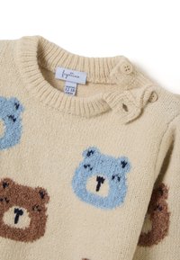 Beige gestrickter Pullover mit Rundhalsausschnitt, der mit blauen und braunen Bärenmotiven verziert ist. Knöpfe an der Schulter für ein einfaches Ankleiden. Größentag: 12-18 Monate.