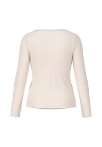 Langärmliges Oberteil in hellbeige, mit glatter Textur, tailliertem Design, Rundhalsausschnitt und minimalen Nähten an den Bündchen und dem Saum.