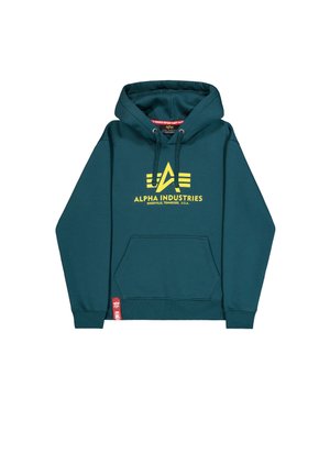 Turkizna kapuca z kenguruvim žepom, žuti "Alpha Industries" logo, kapuljača sa žnjorom i crvena oznaka branda na rubu. Mekana tkanina.