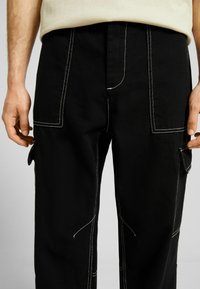 Bershka Tygbyxor - black