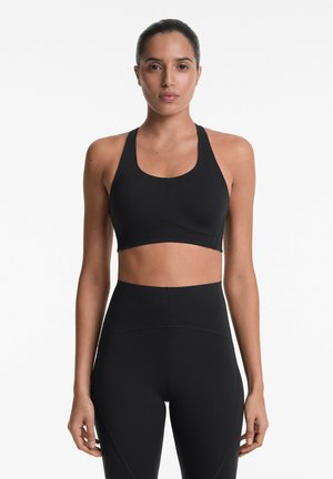 OYSHO FIRM COMPRESSIVE - Reggiseno sportivo con sostegno medio - black