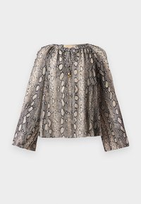 Blouse à manches longues avec imprimé serpent beige et noir, encolure ronde avec cordon et perles dorées, coupe ample.
