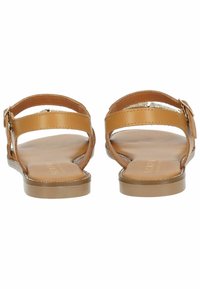 Braune Leder-Sandalen mit flachen Sohlen, die über zwei verstellbare Riemen und eine glatte Oberfläche verfügen. Das Innere hat eine hellere Taubentonfarbe.