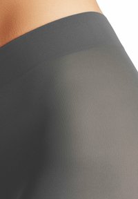 Tessuto grigio a coste con una texture liscia, che presenta un design senza cuciture e una leggera trasparenza in alcune zone.