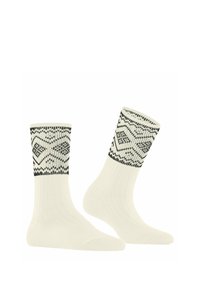 Gestrickte Socken mit einer cremigen Basis und schwarzen geometrischen Mustern am gerippten Bund. Texturiertes, mittelhohes Design. Weiche Stoffkonstruktion.
