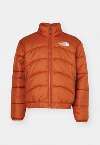 Brun-röd puffjacka med dragkedja fram, två dragkedjefickor på sidorna, elastiska manschetter och fåll samt vit "The North Face"-logga på bröstet.