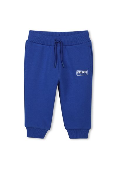 Blauwe katoenen sweatpants met een elastische tailleband, een trekkoord en geribbelde manchetten. Bevat een wit logo-opdruk aan de linkerkant.