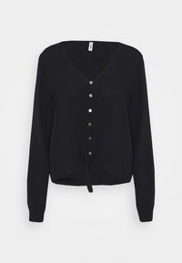 Maglia nera a maniche lunghe con scollatura a V, chiusura con bottoni e orlo annodato. Realizzata in tessuto morbido con una superficie liscia.