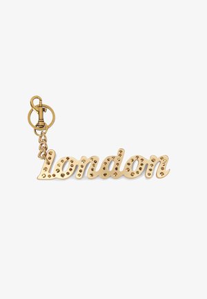 Portachiavi in metallo dorato con la parola "Londra" in un font corsivo, abbellito con piccole pietre rotonde e scintillanti.