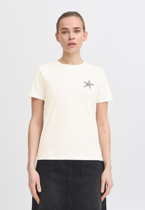 Cream short-sleeve T-shirt with a black starfish graphic on the left chest. The fabric appears soft, with a classic round neckline.