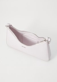 Light pink leather clutch bag with a triangular shape, zipper closure, and silver hardware. Interior includes a card slot and brand logo.