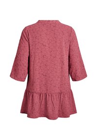 Textured pink dress with a round neckline, three-quarter sleeves, and a flared ruffle hem. Features an all-over floral pattern in darker pink.