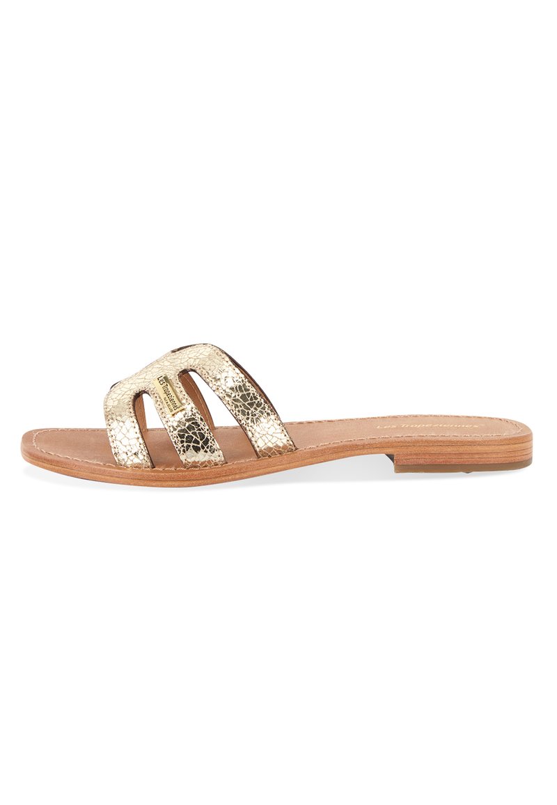 Gold metallic slide sandal with three wide straps, leather footbed, and wooden sole. Features a crackled texture on the upper straps.