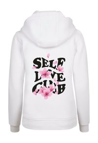 Felpa bianca con cappuccio con la scritta "SELF LOVE CLUB" in grassetto nero, decorata con grafiche di fiori rosa. Tessuto morbido, vestibilità standard e cappuccio.