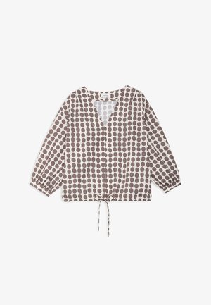 Blouse à manches longues avec col en V, ornée de pois marron sur tissu blanc, avec lien de serrage ajustable à l'ourlet.