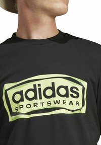 adidas Performance FLD SPW LOGO - T-shirt con stampa - black
