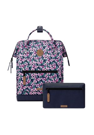 Floral patterned backpack with pink and white flowers, navy blue base and matching navy blue zippered pouch with brown zipper pulls.