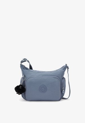 Blue crossbody bag with front zip pocket, side zip pocket, adjustable strap, and a black plush monkey keychain attached.