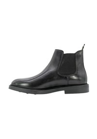 Stivaletto Chelsea nero in pelle liscia con pannello elastico testurizzato ai lati e linguetta per facilitarne l'indossamento. Presenta una suola in gomma piatta per il massimo comfort.
