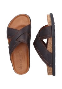 Bruine leren slide-sandalen met kruislings aanbevolen banden, een gevoerd voetbed en een kurken accent op een zwarte rubberen zool.