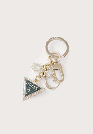Gold keychain with a triangular green enamel pendant, surrounded by rhinestones, featuring "GUESS U.S.A." logo and a decorative charm.