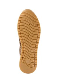 Suola delle scarpe con un motivo ondulato, gomma testurizzata beige. Presenta scanalature circolari ed elongated per aderenza e flessibilità.