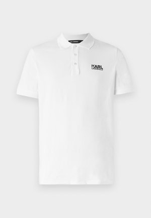 White polo shirt made of cotton, featuring a classic collar, short sleeves, and a black logo on the left chest. Standard fit.