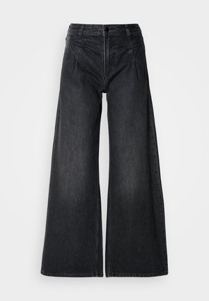 Schwarze weit geschnittene Jeans aus Denim, mit hoher Taille, zwei Fronttaschen und sichtbaren Nähten sowie einer dezenten strukturierten Oberfläche.