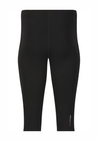 Svarta leggings i ett mjukt, stretchigt material, med en tajt passform och en subtil sidologotyp i vitt. Längd till mitten av vaden utan mönster.