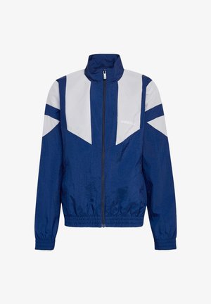 Adidas vindjakke i marineblåt og lysegråt med fuld lynlås foran, høj krave, elastiske ærmegab og talje samt logo på brystet.