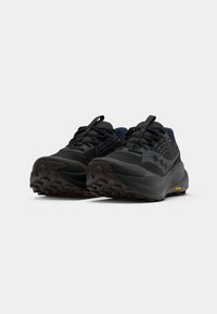 Sorte joggesko med en teksturert syntetisk overdel, Vibram såle og blå detaljer. Har forsterket tå og polstret krage.