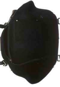 Intérieur d'un sac cabas en cuir noir avec une poche zippée et des compartiments ouverts, montrant une doublure douce et deux poignées solides.