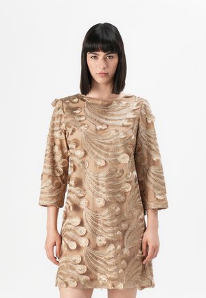 Beige dress with 3/4 sleeves, featuring intricate gold embroidery in a swirling pattern. Smooth texture, short length, and round neckline.