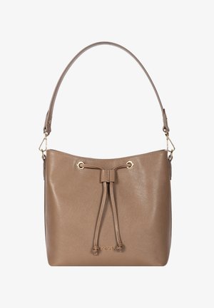 Sac à main en cuir taupe avec une seule anse, oeillets dorés et un détail à cordon frontal sur un fond uni.