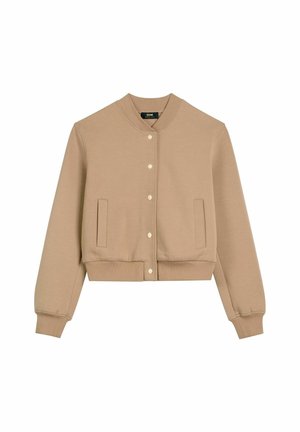 Beżowa krótka kurtka bomber z zapięciem na zatrzaski, prążkowanym kołnierzem, mankietami, pasem oraz dwoma pionowymi kieszeniami z przodu.