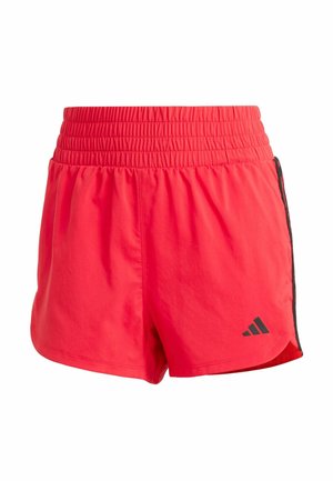Red athletic shorts with an elastic waistband, smooth texture, and black side accents. Features an Adidas logo on the lower left side.