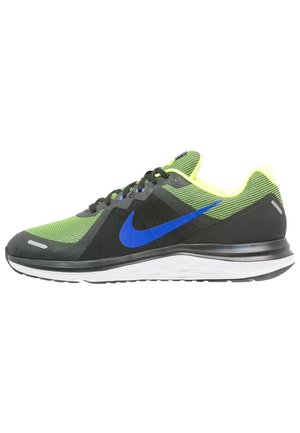 Green and black running shoe with blue Nike swoosh, black laces, white sole, and neon yellow inner lining.