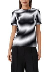 Black and white striped short-sleeve t-shirt made of cotton. Features a round neck and small logo on the chest. Loose fit.