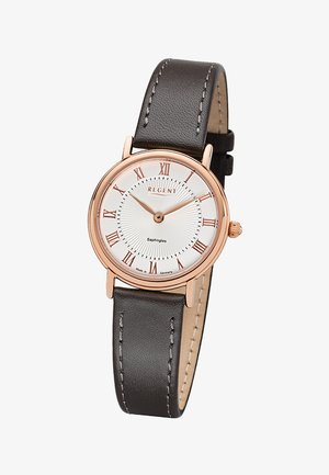 Montre-bracelet ronde avec cadran blanc, boîtier en or rose, chiffres romains et bracelet en cuir marron foncé affichant l'heure 10:10:09.