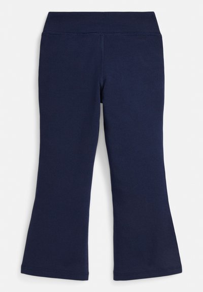 Tamsiai mėlynos spalvos platėjančios tamprės iš minkštos, elastingos medžiagos su plačia juosmens juosta ir lygiais siūlais, sukurtos patogumui ir judėjimo laisvei.