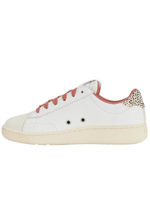 White sneaker with pink laces, round toe, and perforated detail on heel. Textured rubber sole, smooth upper, with contrasting accent patterns.
