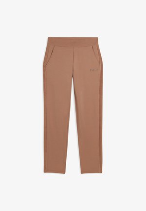 Pantaloni atletici beige con una texture liscia, vita elastica e tasche laterali. Presentano un marchio minimalista sulla gamba sinistra.