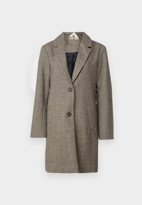 Blazer de cuadros en marrón y crema. Presenta un cuello con muesca, dos bolsillos frontales y botones marrones. Está hecho de una tela texturizada.